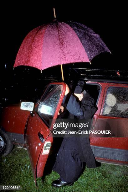 The Priest Under The Rain In France In 1987 - Day or night, a pastor must be willing to give is time and aid anyone in need-a Country Priest: Father...