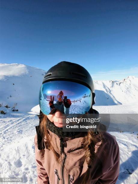 woman skier and reflection in ski goggles - ski goggles stock pictures, royalty-free photos & images