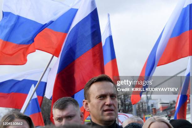 Russian opposition leader Alexei Navalny takes part in a march in memory of murdered Kremlin critic Boris Nemtsov in downtown Moscow on February 29,...