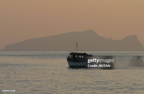 Great Blasket Island, Ireland - Clogher head and a small fishing boat.