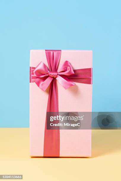 pink gift box on blue - still life not people stock pictures, royalty-free photos & images