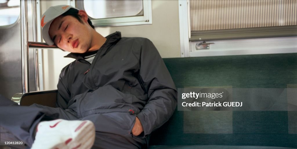 Nap In The Metro In Tokyo, Japan -