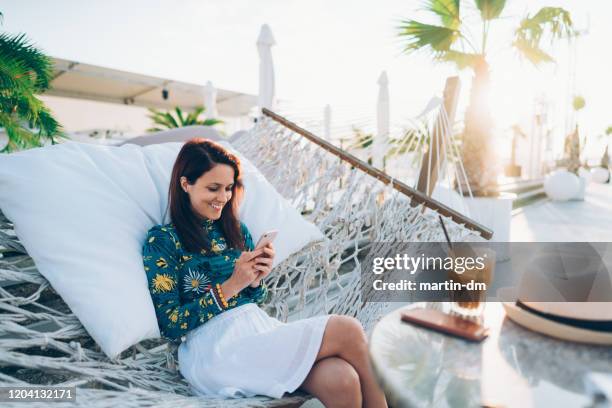 summer vacation - hammock phone stock pictures, royalty-free photos & images