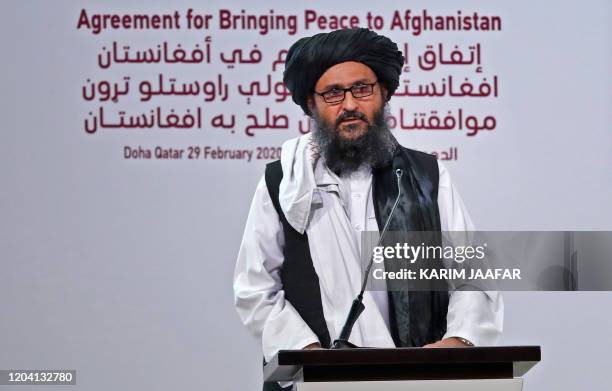 Taliban co-founder Mullah Abdul Ghani Baradar speaks at a signing ceremony of the US-Taliban agreement in the Qatari capital Doha on February 29,...