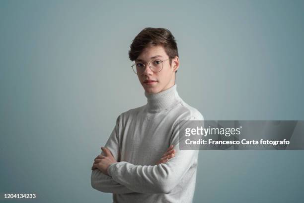 portrait of young man wearing eyeglasses - white polo stock pictures, royalty-free photos & images