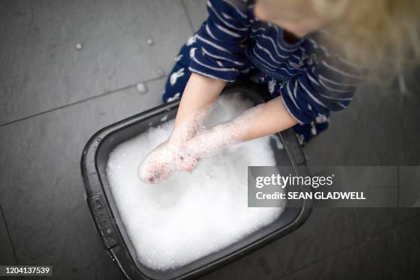 young girl washing hands - wash bowl stock pictures, royalty-free photos & images