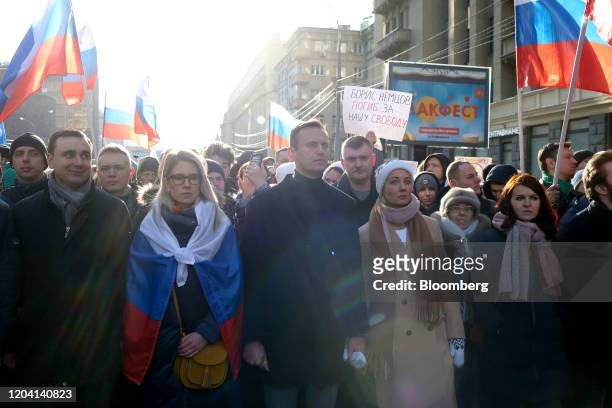 Alexey Navalny, Russian opposition leader, center, stands with his wife Yulia, center right, during a rally in Moscow, Russia, on Saturday, Feb. 29,...