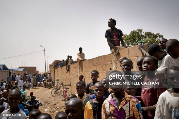 Group of children wait for the arrival of the governor of Mopti in Djenne on February 28, 2020. - A week earlier Mali's Prime Minister announced the...