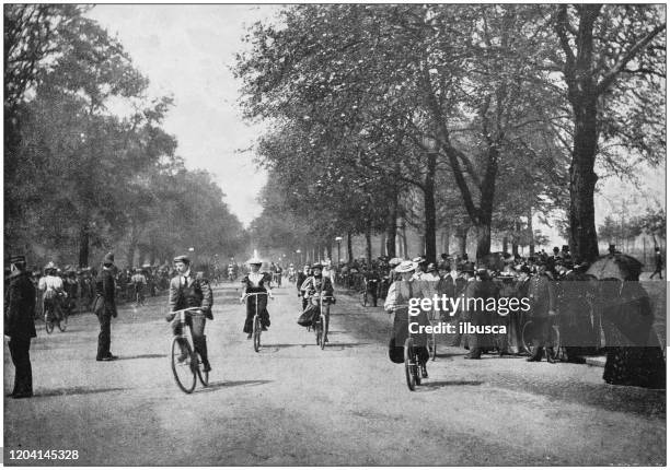 antique photograph of the british empire: cycling in hyde park, london, england - vintage bicycle stock illustrations