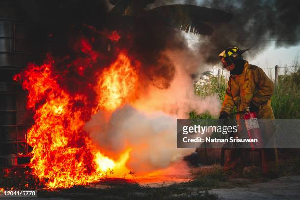 firefighter used carbon dioxide fire extinguishers. - quartel de bombeiros imagens e fotografias de stock