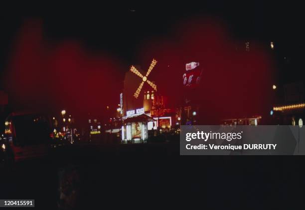 Paris by night : Le Moulin Rouge at Pigalle in Paris, France.