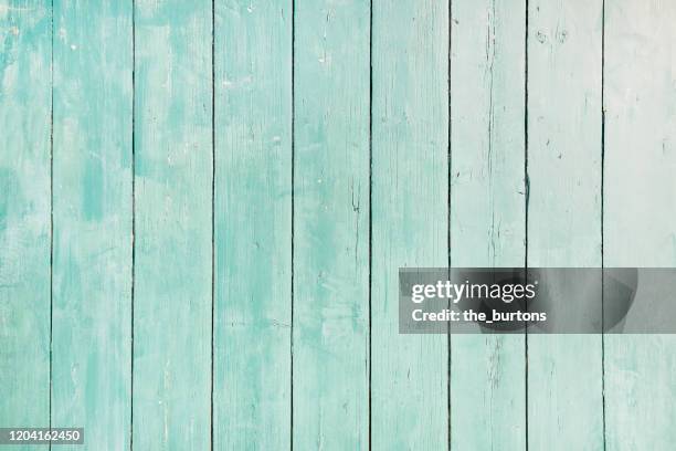 full frame shot of light turquoise painted wooden wall, abstract background - turkoois stockfoto's en -beelden