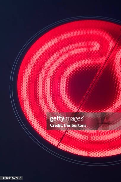 high angle view of a stove top, heated ceramic hob - burner stove top stockfoto's en -beelden