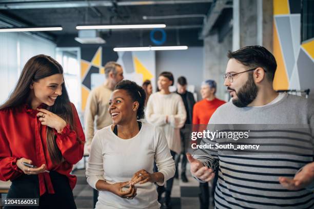 people working together in big modern office - large conference event stock pictures, royalty-free photos & images