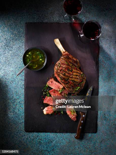 on the bone rib steak - tomahawk stock pictures, royalty-free photos & images