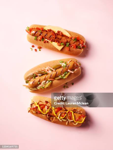 3 varieties of hotdogs - food on coloured background stock pictures, royalty-free photos & images