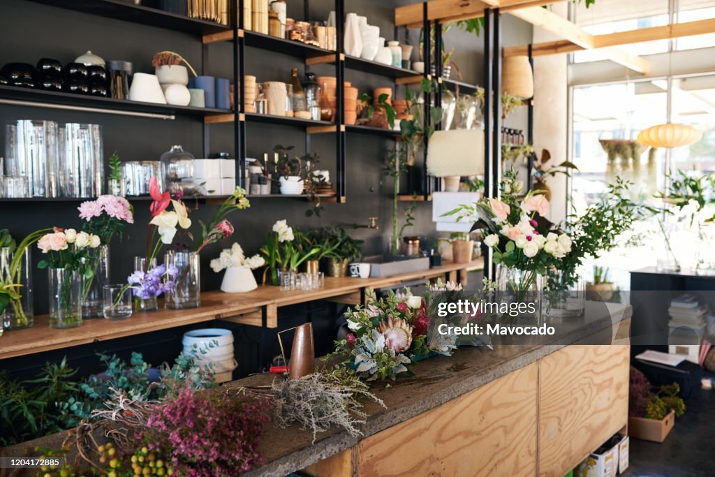 Display of vases and floral arrangements in a flower shop