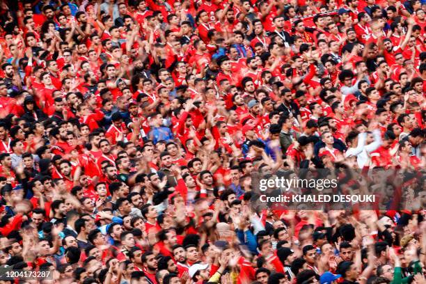 Egypt's Ahly SC football fans cheer for their team ahead of the first leg of the CAF Champions League Quarter-final football match between Egypt's...