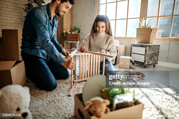 we are happy in new apartment - couple young teddy bear stock pictures, royalty-free photos & images