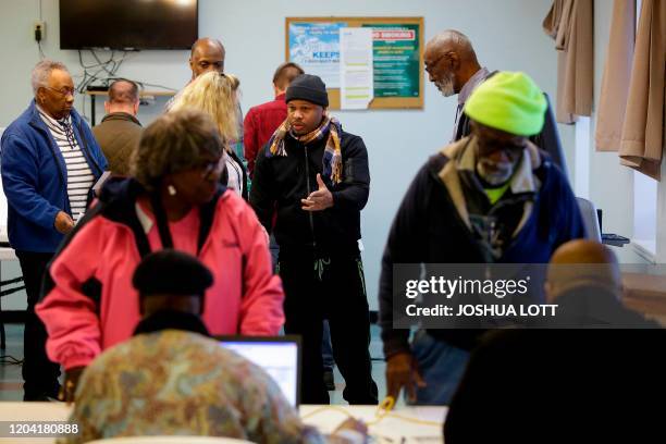 Voter speaks with a poll worker about his ballot being counted at a polling station located at the Charleston County Housing and Redevelopment...