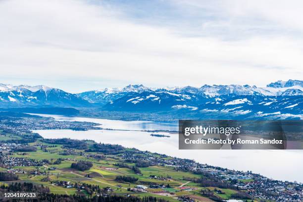 aerial view of the lake of zurich with swiss alps - rapperswil stock-fotos und bilder