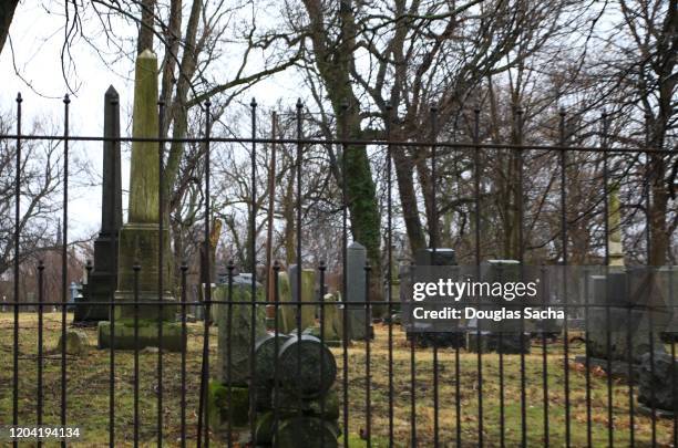 cemetery behing an iron gate - file graveyard fields 3.jpg stock pictures, royalty-free photos & images