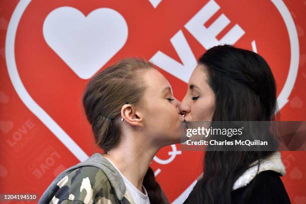 Robyn Peoples and Sharni Edwards, Northern Ireland's first same-sex couple to be legally married, kiss during a pre-wedding press conference on...