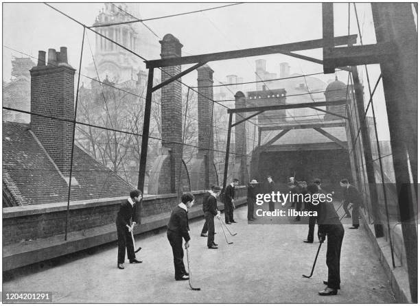 antique photograph of the british empire: hockey on the house-top - ice hockey classic stock illustrations