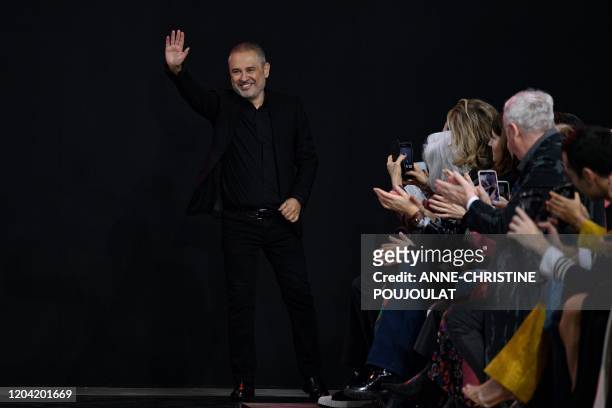 Lebanese fashion designer Elie Saab acknowledges the audience at the end of the Women's Fall-Winter 2020-2021 Ready-to-Wear collection fashion show...