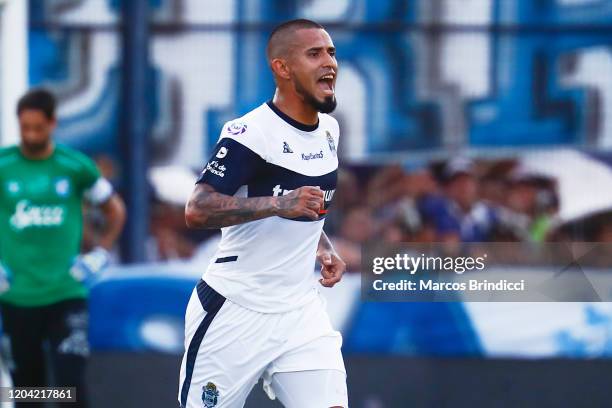 Victor Ayala of Gimnasia y Esgrima La Plata celebrates the first goal of his team scored by teammate Matias Garcia during a match between Gimnasia y...