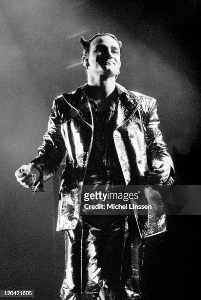 Photo of BONO and U2, Bono performing live onstage dressed as Mister Macphisto character, with devil horns on ZOO TV tour at Ahoy in Rotterdam,...