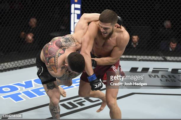 Ismail Naurdiev punches Sean Brady in their welterweight bout during the UFC Fight Night event at Chartway Arena on February 29, 2020 in Norfolk,...