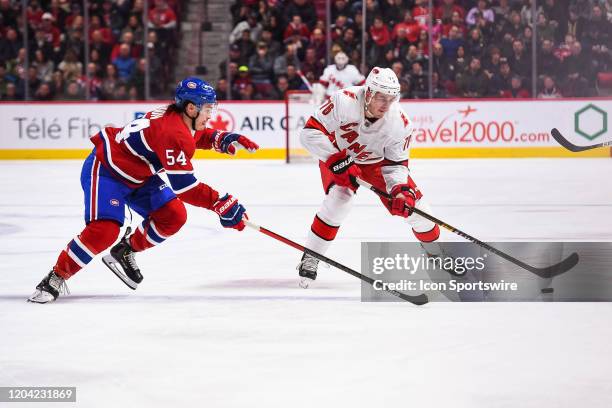 Montreal Canadiens left wing Charles Hudon skates towards Carolina Hurricanes defenceman Brady Skjei along the blue line during the Carolina...