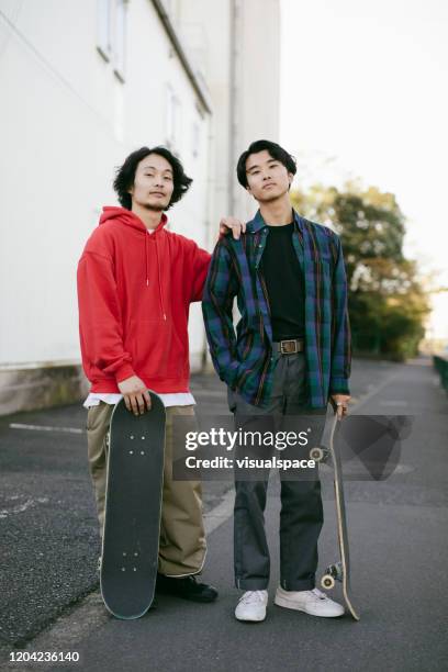 two skateboarders - fashion design minimalist edgy stock pictures, royalty-free photos & images