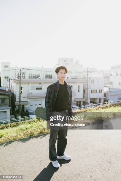 portrait of asian skater - fashion design minimalist edgy stock pictures, royalty-free photos & images