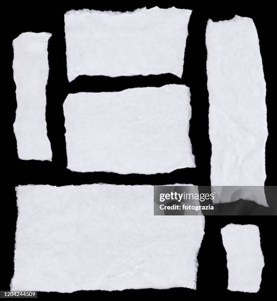 pieces of white paper on black background - torn paper set stock pictures, royalty-free photos & images