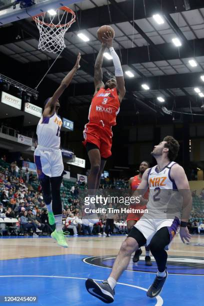 Antonius Cleveland of the Texas Legends drives against Tariq Owens of the Northern Arizona Suns during the first quarter on February 29, 2020 at...
