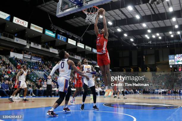 Moses Brown of the Texas Legends dunks over Jalen Lecque of the Northern Arizona Suns during the second quarter on February 29, 2020 at Comerica...