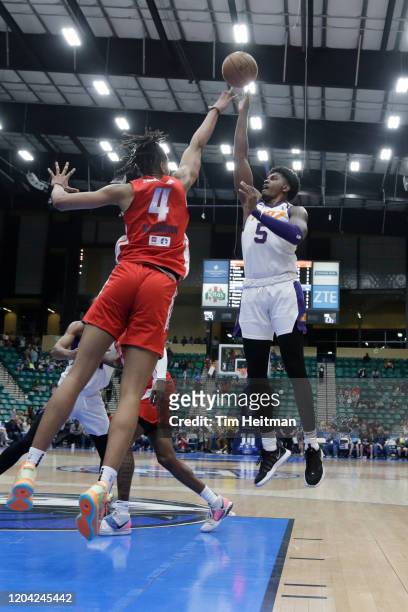 Anthony Lawrence of the Northern Arizona Suns shoots over Moses Brown of the Texas Legends during the fourth quarter on February 29, 2020 at Comerica...