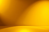 Beams of spotlight on a yellow background