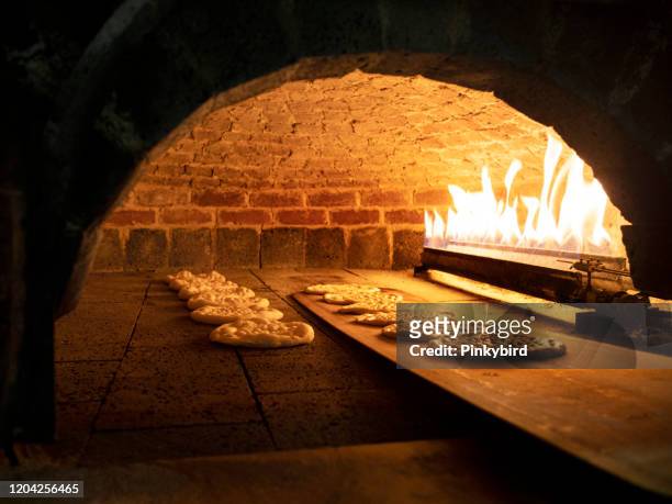 pitta bread in a brick oven, brick oven,stone oven, - pita bread stock pictures, royalty-free photos & images