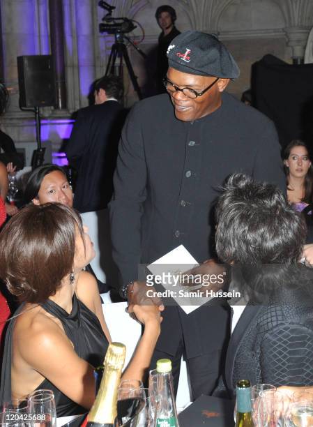Ronnie Wood and Ana Araujo meet Samuel L Jackson at the FitFlop Shooting Stars Benefit Closing Ball following a two-day golf tournament raising vital...