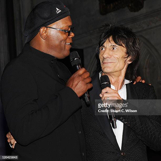 Samuel L Jackson and Ronnie Wood speak during the FitFlop Shooting Stars Benefit closing ball at the Royal Courts of Justice. The event was hosted by...