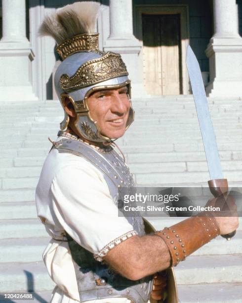 Mel Brooks, US factor, film director and comedian, brandishing a sword and dressed in a style of a Roman centurion in a publicity portrait issued for...