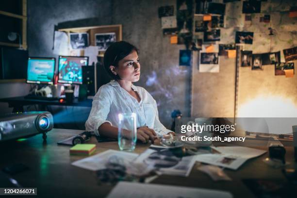 policewoman working late - detective stock pictures, royalty-free photos & images