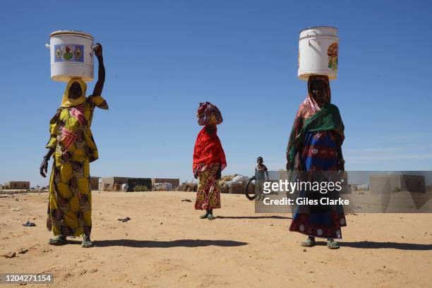 December 11, 2019. Three Northern Nigerian women who now live as refugees in the Diffa region of South East Niger. They are some of the 280,000...