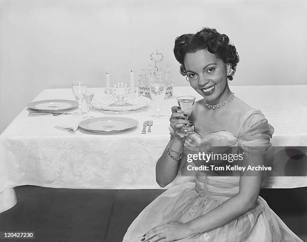 woman holding glass of drink, smiling, portrait - archival alcohol stock pictures, royalty-free photos & images