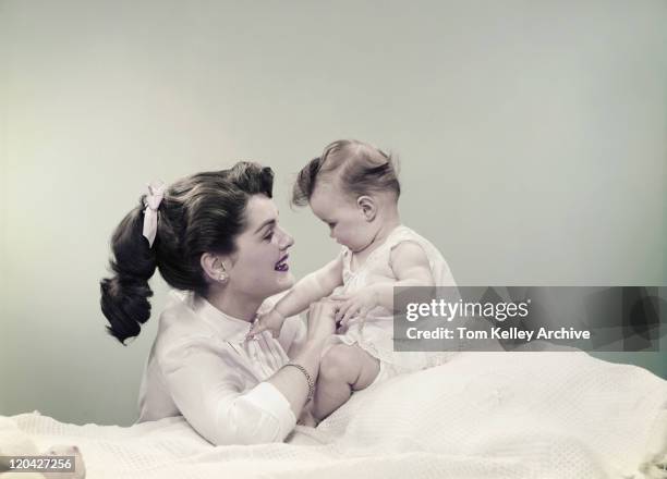 mother with baby, smiling - vintage mother and child stock pictures, royalty-free photos & images