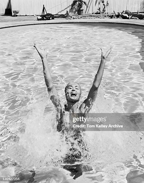 woman having fun in swimming pool - archive black and white stock pictures, royalty-free photos & images