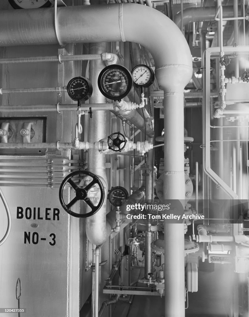 Pressure gauges on pipes in factory